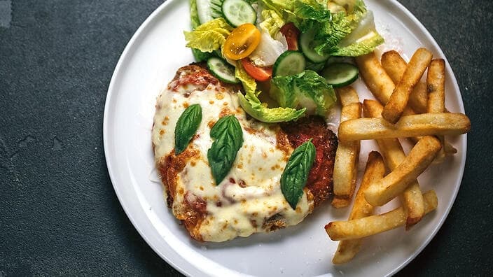 Pub vs. Fine Dining: How Different Venues Approach the Classic Parmi