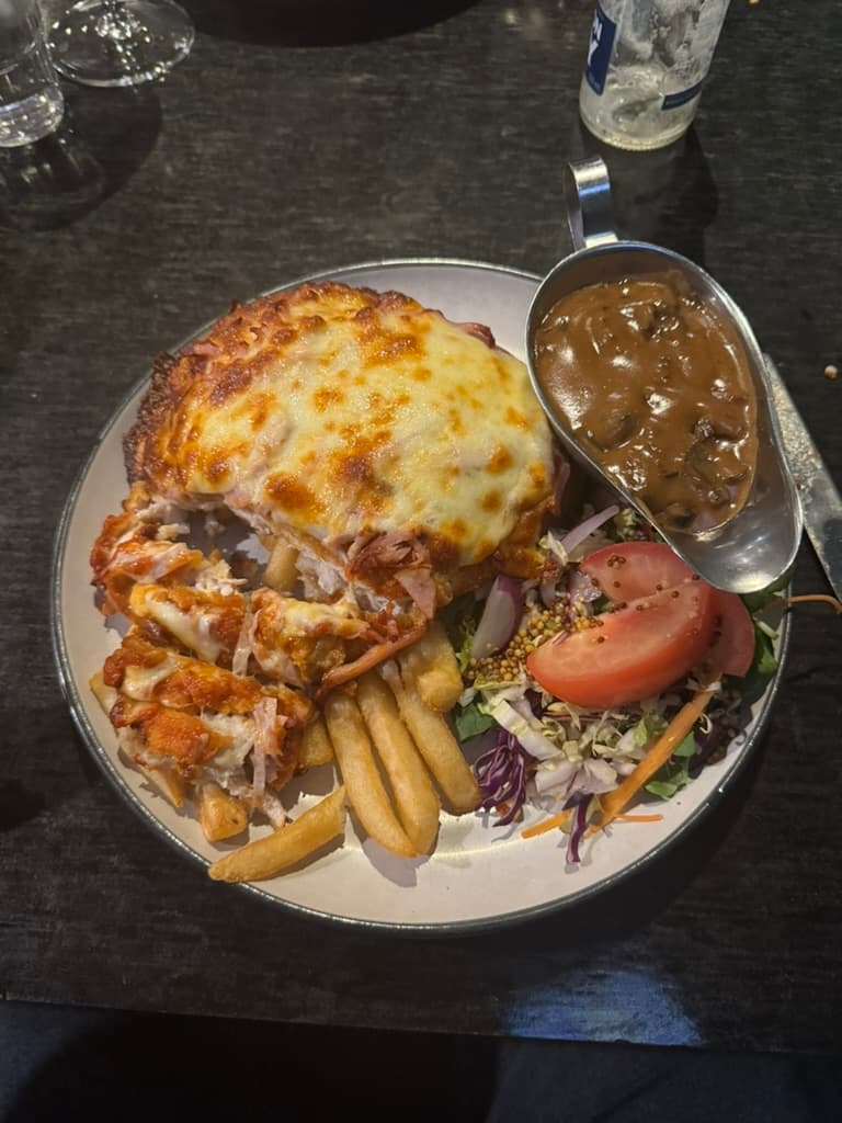 Chicken parmi from Penguin Pub
